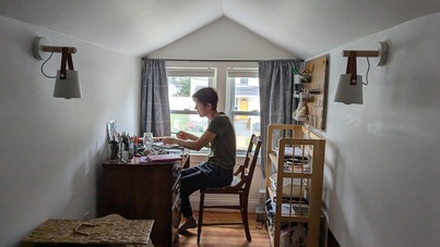 Claire working at their desk